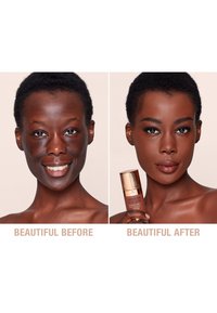 Before and after images feature a person showcasing skin tone. Left: natural complexion. Right: holding a gold-capped brown foundation bottle.