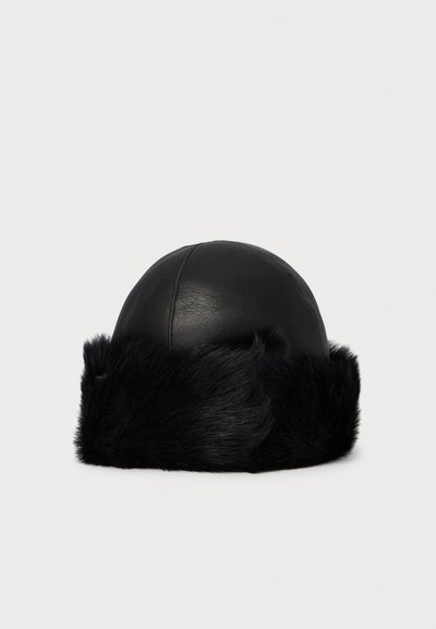 Black leather winter hat with a wide, soft black fur trim around the base, displayed against a plain white background.
