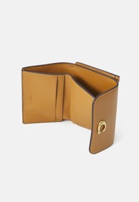 Brown leather wallet opened to show interior; features card slots, a smooth texture, contrasting stitching, and a gold-tone hardware accent.