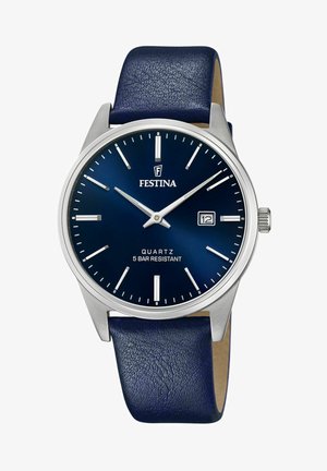 Reloj de cuarzo Festina con una esfera azul, caja de acero inoxidable plateado y una correa de piel azul marino. Incluye una pantalla de fecha y marcadores de minutos.