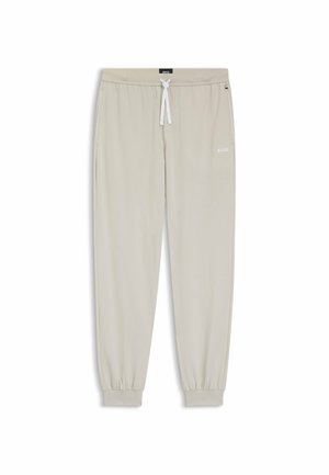 Pantalon de jogging beige clair avec poignets et taille élastiques, cordon blanc, poches latérales et logo BOSS sur la cuisse gauche et la taille.