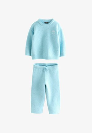 Light blue, soft knit set with a crew neck sweater and matching jogger pants. Features ribbed cuffs and waistband. Small logo on the sweater.