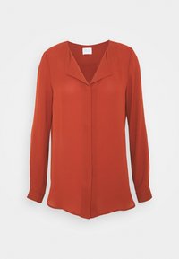Blouse rouge à manches longues en tissu lisse, dotée d'un col pointu et d'une fermeture à boutons sur le devant, avec une coupe droite et des fentes sur les côtés.
