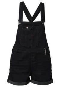 Salopette courte en denim noir avec poche poitrine avant, bretelles croisées réglables, ourlet retroussé et fermetures latérales à boutons.