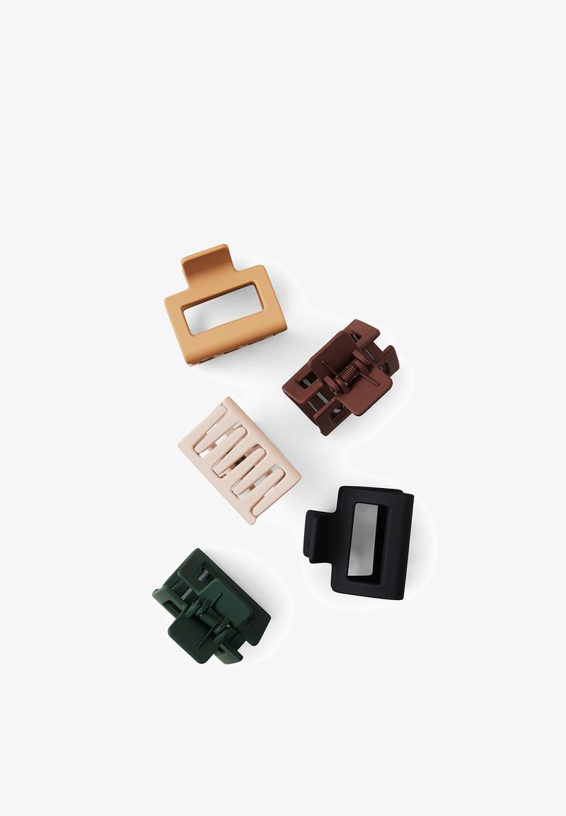 Five matte plastic hair claw clips in beige, tan, brown, black, and dark green on a white background.