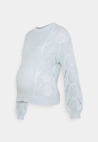 Ljusblå stickad gravidtröja med en lös passform, med texturerade mönster, rund halsringning och ballongärmar.