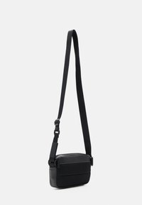 Calvin Klein Jeans MONOGRAM SOFT CAMERA BAG UNISEX - Cross body bag - black