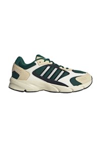Baskets de sport vertes et crème dotées d'une tige en mesh, d'accents en daim, de rayures noires et d'une semelle Cloudfoam pour un amorti.