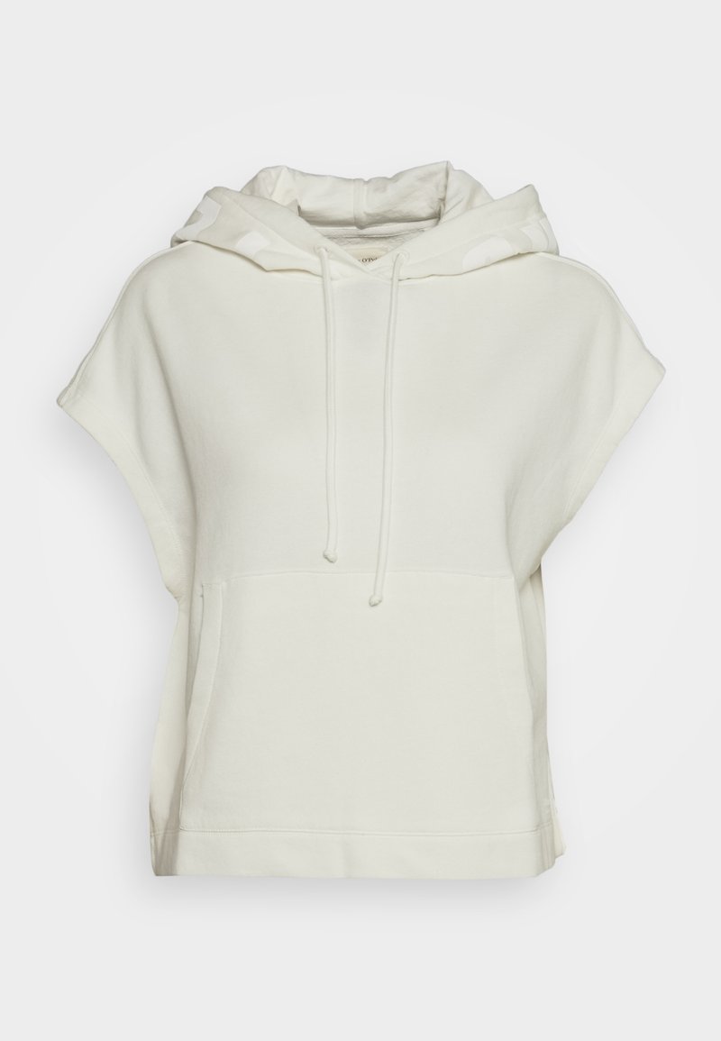 Cremefarvet oversized hættebluse med korte ærmer, snøre i hætten og frontlomme. Blødt bomuldsstof med en glat tekstur.