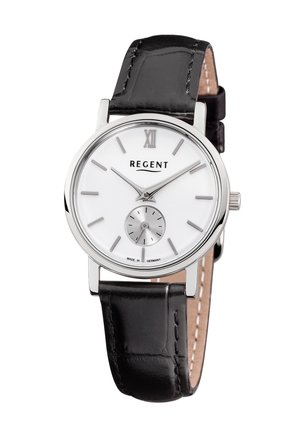 Montre argentée avec un cadran rond blanc, un bracelet en cuir noir et des index horaires argentés minimalistes. Dispose d'un petit sous-cadran pour les secondes.