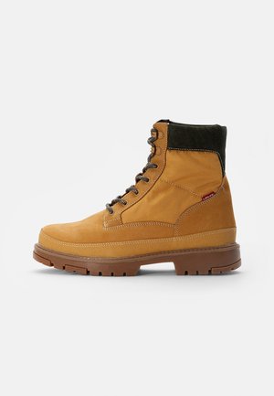TORSTEN QUILTED - Lace-up ankle boots - medium yellow