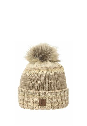 Knitted beige beanie with a fluffy pom-pom on top, featuring a ribbed cuff and subtle texture variations in the yarn. Logo patch on cuff.