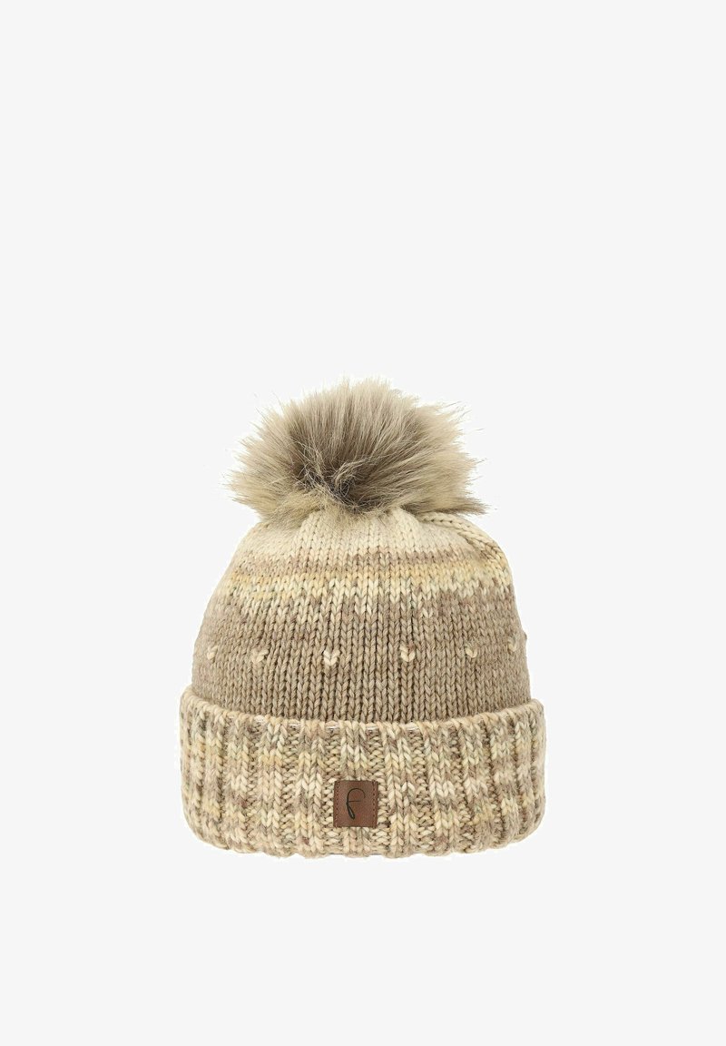 Knitted beige beanie with a fluffy pom-pom on top, featuring a ribbed cuff and subtle texture variations in the yarn. Logo patch on cuff.
