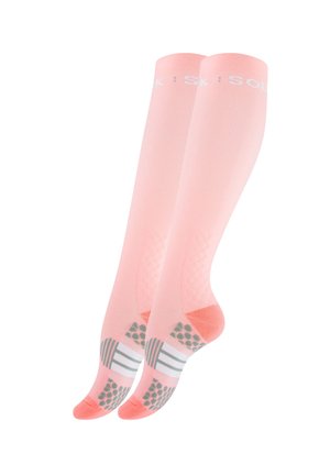 Chaussettes de compression roses avec des semelles texturées antidérapantes. Elles se caractérisent par une couleur unie avec un logo blanc en haut et des accents à motifs en bas.