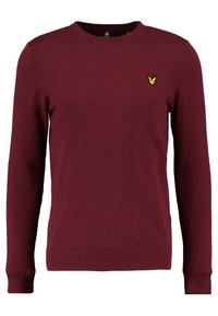 Bordeauxfarbener Rundhalsausschnitt-Pullover aus weichem Strickstoff. Hat einen gerippten Saum und Bündchen sowie ein kleines gelbes Logo auf der Brust.