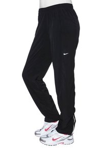 Black athletic pants with elastics waistband, side pockets, and white Nike logo on left thigh. Smooth, lightweight material with a tapered fit.