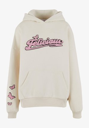 Cream hoodie with pink embroidered "Felicicious" text, front kangaroo pocket, and three pink butterfly designs on the left sleeve.