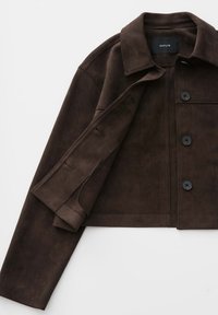 Dark brown suede cropped jacket with collar, three black buttons, and long sleeves, partially opened to show buttonholes.