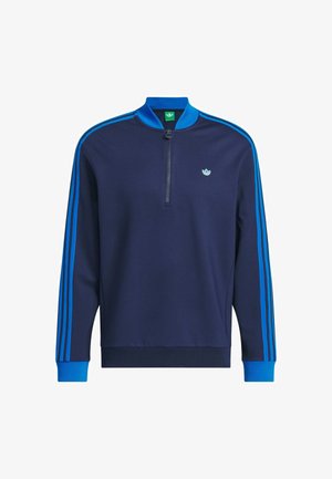 Sudadera de punto navy con cuello de media cremallera, rayas de acento azules en las mangas y un pequeño logo en el pecho. Tejido suave con puños acanalados.