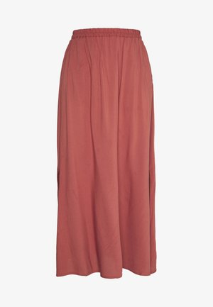 Rust-colored, ankle-length skirt with elastic waistband and subtle side slits, made of lightweight fabric.