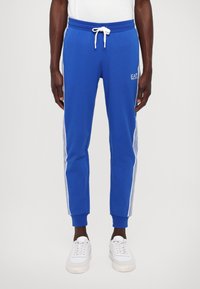 EA7 Emporio Armani PANTALONI - Treniņtērpa apakšdaļas - lapis blue