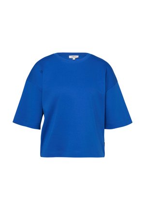 Niebieski, oversize'owy t-shirt z krótkim rękawem, okrągłym dekoltem i opadającymi ramionami, z małą metką marki wewnątrz przy szyi.