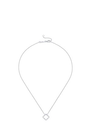 Silver chain necklace with a small open quatrefoil pendant adorned with small round stones and a lobster clasp closure.