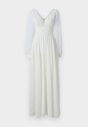 Pikk valge kleit V-kaelusega, istuv kehaosa ja voolav seelik. Omab pikki läbipaistvaid varrukaid ja tagumist tõmblukku. Sile tekstuur.