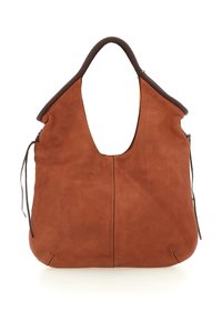 Borsa tote in morbido cuoio marrone con una ampia tracolla curva e dettagli con fiocchi laterali su uno sfondo bianco.