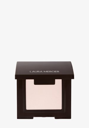 Laura Mercier presset pudderkompakt i svart innpakning med et klart vindu, som inneholder et lys beige pudder inni.