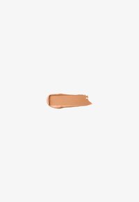 Beige cosmetic foundation swatch with a smooth, creamy texture; even tone; and a subtle sheen against a white background.
