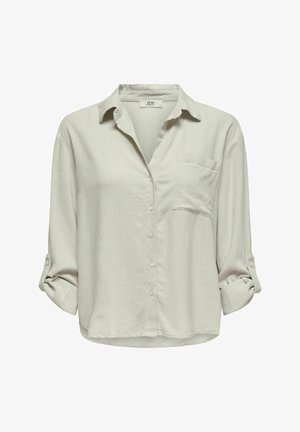 Lichtgrijs button-up overhemd met een borstzak, opgerolde mouwen en een relaxte pasvorm. Gemaakt van zachte, gestructureerde stof.