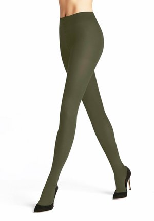 Olivgrüne Strumpfhosen aus einem dehnbaren Material, mit glatter Textur und hohem Bund, kombiniert mit schwarzen High Heels.