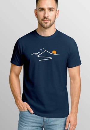 Navy blue t-shirt made from cotton featuring a white graphic of mountains and a sun in orange. Short sleeves, crew neck design.