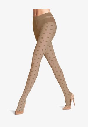 Hautfarbene, gepunktete Strumpfhosen mit transparenter Oberfläche, die tanfarbene Kreis-Muster und eine glatte Textur aufweisen, kombiniert mit beigen High Heels.