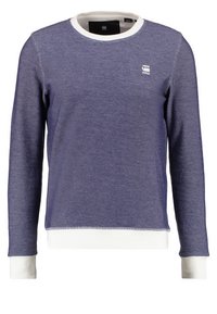 Námořnicky modrý svetr s texturovaným povrchem, bílý kulatý výstřih a manžety. Jemné logo na hrudi; dlouhé rukávy a rovný lem.