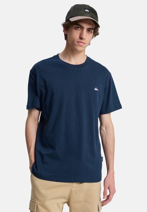 Navy blue cotton t-shirt with a crew neck, short sleeves, and a small white logo on the chest. Smooth texture, relaxed fit.