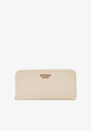Portefeuille Guess couleur crème avec logo doré et fermeture éclair, rectangulaire avec bords arrondis, présenté sur fond blanc.