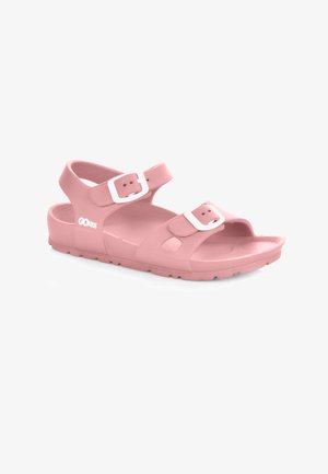 Różowe sandały wykonane z gładkiego kauczuku, z dwiema regulowanymi klamrami w kolorze białym, otwartym noskiem oraz teksturowaną podeszwą dla lepszej przyczepności.
