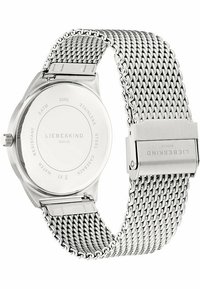 Edelstahl-Armbanduhr mit einem Netzband und Verschluss. Verfügt über einen glatten, runden Gehäuseboden mit eingeprägtem Markennamen und wasserdichten Details.