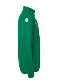 Groene lange mouwenjas met een hoge kraag. Kenmerkt zich door een schoon ontwerp, zachte stofstructuur en een logo aan de bovenlinkerkant.