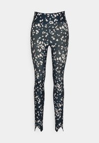 Leggings de alta cintura em azul marinho escuro com um padrão abstrato em branco e cinza. Apresentam um design elegante e um tecido texturizado com bainhas pontiagudas.