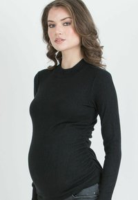 Black ribbed long-sleeve maternity top with a fitted design and crew neckline, featuring side ruching for a comfortable fit.