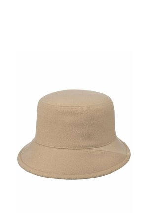 Beige bucket hat with soft, felt-like texture and a gently downward-sloping brim, featuring subtle stitching details around edges.