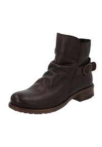 Botte en cuir marron à la cheville avec un design décontracté, bout arrondi, et une sangle sur le côté avec une boucle. Dotée d'un talon bas et texturé pour une meilleure adhérence.