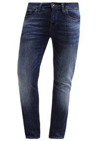 Mörkblå denimjeans med slim fit, utrustade med femficksdesign, bälteshögar och subtil blekning på låren. Slät textur, klassisk skärning.