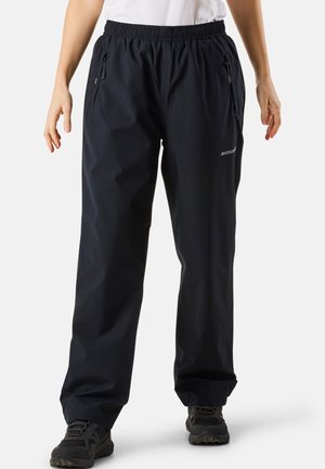 Black waterproof pants with an elastic waistband, zipper pockets, and a reflective accent. Made from a smooth, lightweight material.