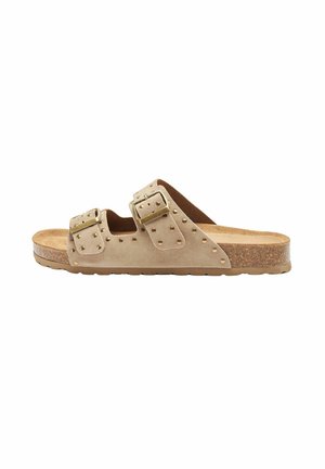 Sandali in suede beige con due cinturini regolabili, decorati con borchie metalliche, e una soletta in sughero con suola纹ata per una migliore aderenza.