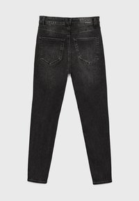 Svarta slim fit-jeans i denim, med en standard midja, femficksdesign och kontrasterande sömmar på fickorna.