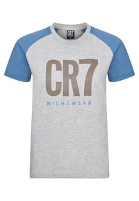 Gray t-shirt with blue raglan sleeves. Features large "CR7" in brown and "NIGHTWEAR" in blue print across the front. Soft cotton material.
